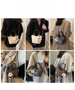 Collage of chic bucket bags in cream black and brown with plush sheep charm detail