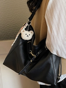 Large black PU leather tote bag with plush bear pendant and striped scarf detail