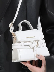 White mini square bag with top handle and fashion text logo for stylish winter commute