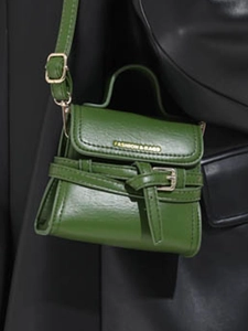 Chic green mini square crossbody bag with top handle and adjustable shoulder strap