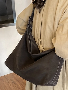 Minimalist brown oversized hobo shoulder bag with white contrast stitching for daily commute