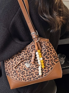Retro leopard print shoulder bag with bow detail and heart charm for women