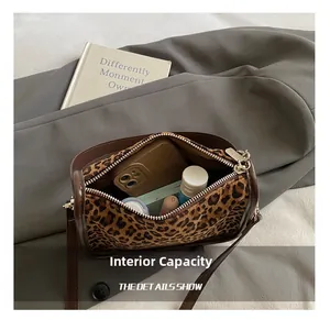 Detail view of the interior capacity showing storage space for phone and cosmetics
