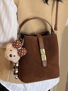 Vintage dark brown suede bucket bag with gold buckle and cute bear charm for women