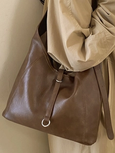 Minimalist brown leather hobo bag with large capacity and soft texture for women