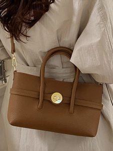 Brown lychee leather tote bag with gold cylinder twist lock and detachable strap