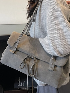 Minimalist grey suede tote bag with woven strap and silver rivets for women