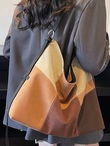 Color block patchwork tote bag in earth tones with shoulder strap for casual style