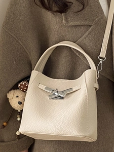 Retro cream litchi texture leather bucket bag with silver metal lock and bear charm