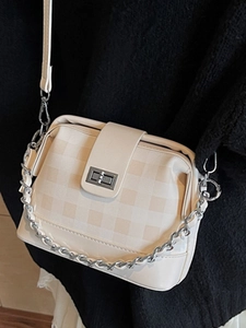 Minimalist beige checkerboard crossbody bag with silver chain strap and metal lock