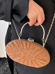 Elegant oval brown textured evening clutch bag with gold handle and chain strap for women