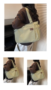Détail du grand sac cabas vert clair avec écusson logo en cuir et poche zippée latérale