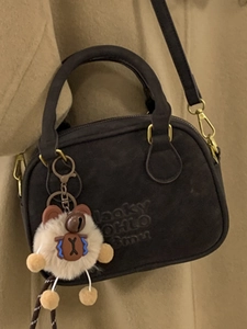 Vintage retro bowling bag in textured dark brown with bear charm and embossed lettering
