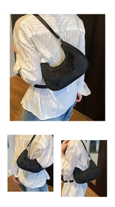 Detail of black butterfly lace embroidery on luxury aesthetic hobo shoulder bag