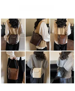 Detail view of four-color glossy leather bucket bags with stylish side tassel and flap