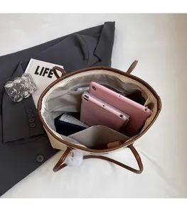 Top-down view of spacious tote bag interior with pockets and office essentials