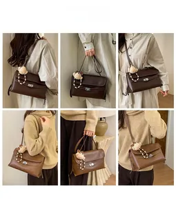 Detail view of retro shoulder bags in brown with cute bear charms and metal locks