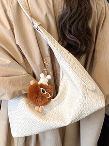 Minimalist beige woven hobo tote bag for women with decorative plush charm accessory