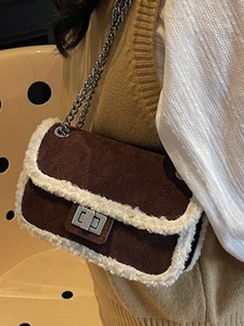Brown suede quilted crossbody bag with cream faux fur trim and silver chain strap
