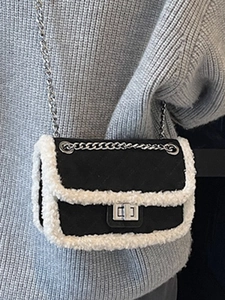 Quilted mini crossbody bag in black fabric with white faux shearling trim and silver chain