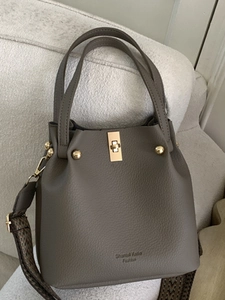 Deep grey litchi grain leather bucket bag with golden hardware and ethnic strap