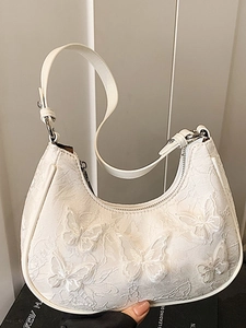 White hobo shoulder bag with lace butterfly embroidery and elegant silver metal buckle