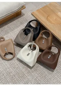 Detailed overview of multiple colors of vintage leather bucket bags with metal locks