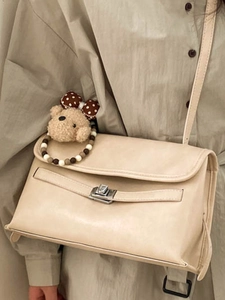 Vintage cream tote bag for women featuring a teddy bear charm and beaded strap detail