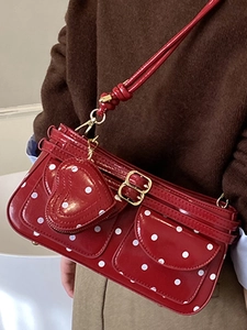 Polka dot red leather mini handbag with heart charm and golden metal hardware