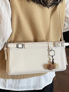 Retro cream white large capacity underarm shoulder bag with metal buckles and plush charm