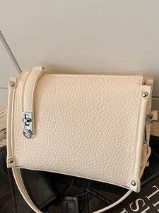 Minimalist cream white leather square crossbody bag with silver lock and rivet detail