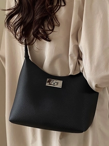 Minimalist black lychee pattern leather hobo shoulder bag with silver turn-lock closure