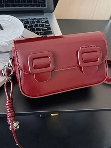 Trend wine red patent leather shoulder saddle bag with large decorative buckles and strap