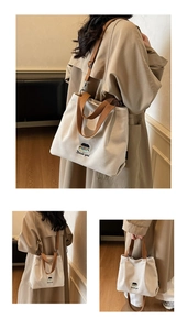 Three-way view of beige canvas tote bag with brown straps and cute character embroidery