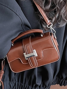 Brown glossy patent leather crossbody bag with silver buckle and top handle for women