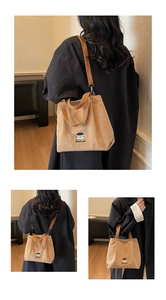 Detailed embroidery and corduroy texture of the khaki large capacity tote bag