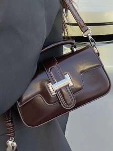 Brown glossy PU leather shoulder bag with silver clasp and heart charm detail