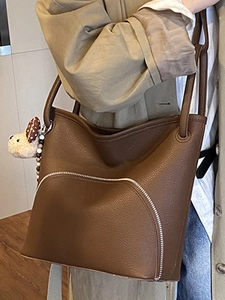 Retro brown lychee leather tote bag with silver zipper and cute plush dog charm