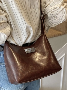 Minimalist dark brown oil wax leather shoulder bag with silver rotating metal buckle clasp