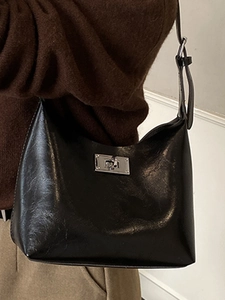 Minimalist black leather shoulder bag with silver metal lock for daily commuting