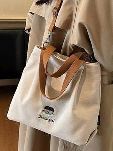 Minimalist embroidered canvas tote bag with girl pattern and adjustable straps