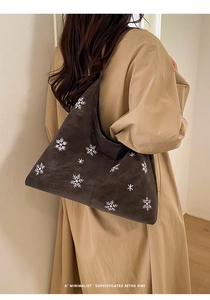 Brown frosted tote bag with snowflake embroidery shown on model for autumn commute style