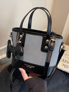 Retro black leather and blue denim bucket bag with cute dog charm and shoulder strap