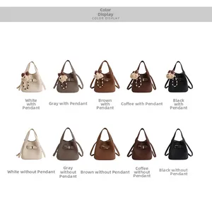 Detailed grid of leather bucket bags in five colors with optional bear charm accents