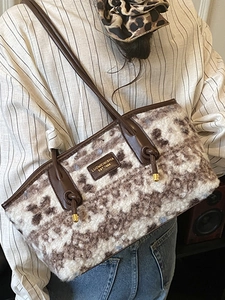 Vintage faux fur tote bag for women with brown leather straps and spacious interior design