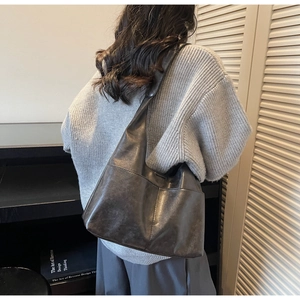 Detailed view of the dark grey matte suede tote bag with retro frosted texture finish