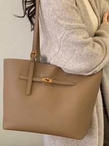 Taupe large capacity leather tote bag with gold swivel lock for women's daily commute