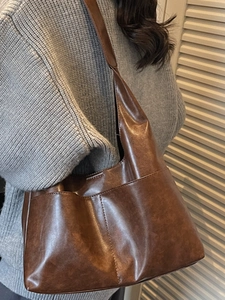 Retro dark brown faux suede tote bag featuring a large capacity and matte vintage texture