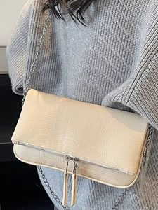 Fashionable beige pebbled leather crossbody chain bag with unique dual zipper flap