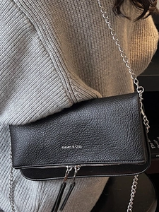 Fashionable black lychee grain leather crossbody bag with silver chain strap and dual zippers